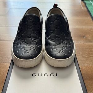 Gucci Men's Black Embossed Slip-On Loafers